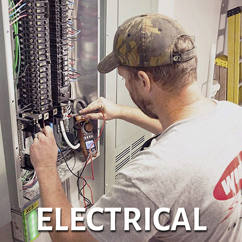 Electrician working on electrical panel - link